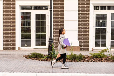 little girl with a backpack going to schoolの写真素材