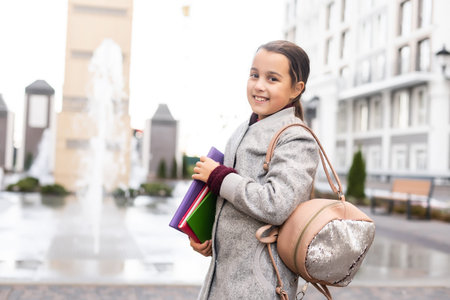 Beautiful young elementary school girl autumnの写真素材