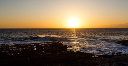 Evening scene on sea, stones, calm oceanの写真素材