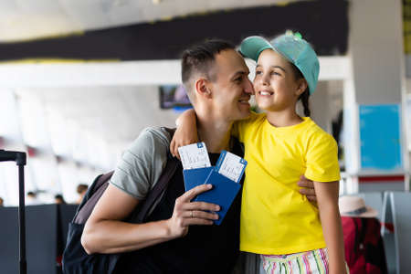 Little girl with her father at airportの写真素材