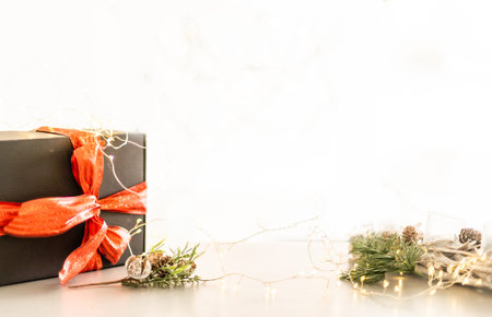 Merry Christmas and Happy Holidays greeting card, frame, banner. New Year. Christmas silver handmade gift boxes on white marble background top view. Winter holiday theme.の写真素材