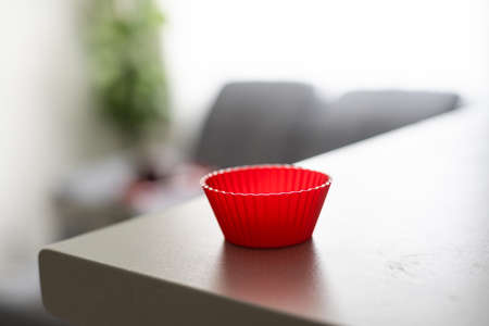 Red silicone cake pan on a tableの写真素材