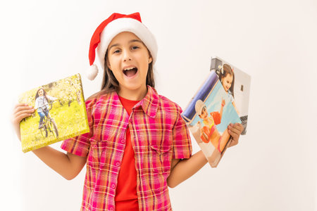Christmas girl standing with photos on canvas isolated on white