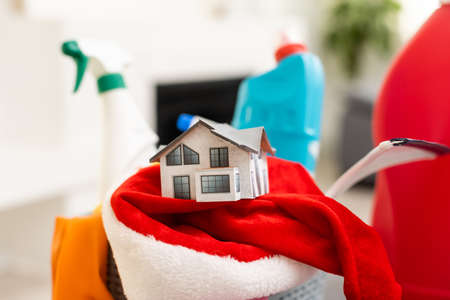 Minimal Christmas background with household chemicals. Plastic. Happy New Year. House and apartment cleaning before Christmas.の写真素材