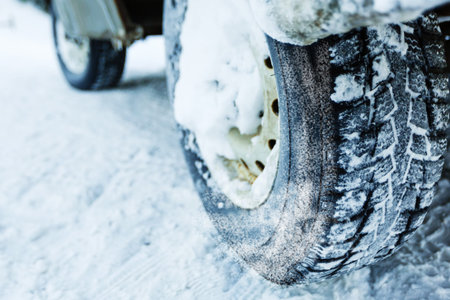 Car tires on winter road