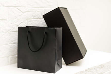 Black cardboard box over white background.の写真素材