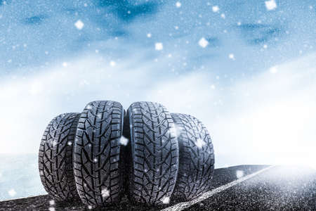 Car tires on winter roadの写真素材