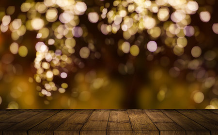 Bokeh background with empty wooden deck table for product montage display