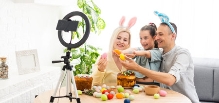 Father, mother and her child enjoy painting Easter eggs. Shop Online for happy easter decoration....