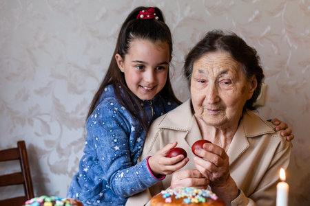 senior woman with easter eggs and Easter cake