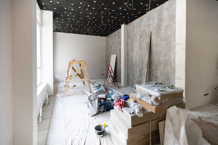 The wall of the building is covered with fresh plaster and surrounded by construction. Background.の写真素材