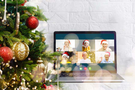 laptop with gift box and christmas lights background.の写真素材