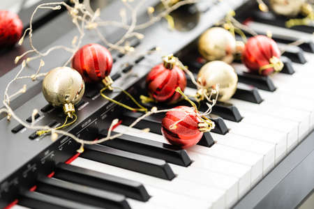 Piano keys with Christmas decorations, closeupの写真素材
