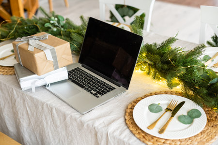 laptop with gift box and christmas lights backgroundの写真素材
