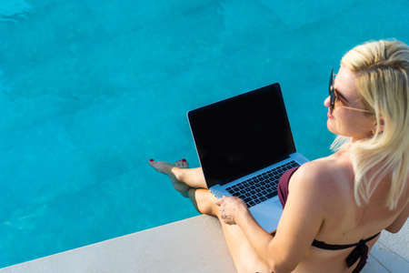 Beautiful Business Woman Working Online On Laptop Computerの写真素材