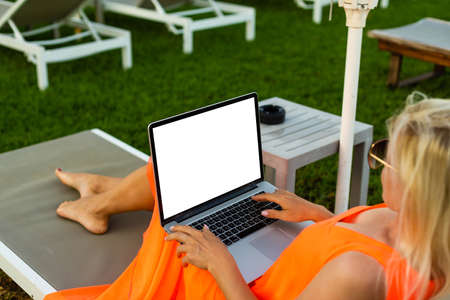 woman working comfortably on the swimming poolの写真素材