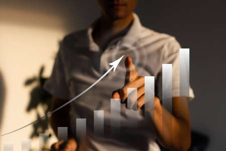 businessman hand working with virtual chart business on touch screen computer as conceptの写真素材
