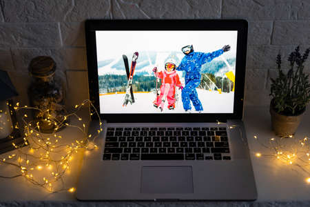 young girl happy positive smile conversation online internet computer family holiday indoorsの写真素材