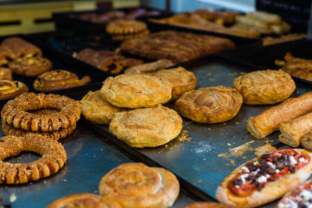 typical Greek sweet street baked goods in a storefront of a Greek pastry.の写真素材