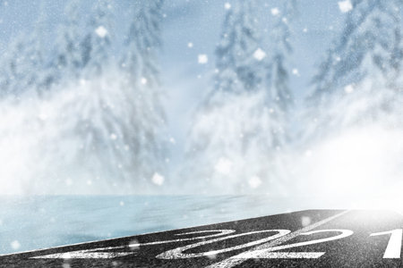 Happy new year 2022 written, winter landscape with road