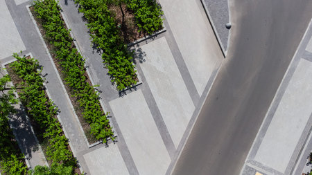 aerial top view of street with parking lot near new residential housing complex