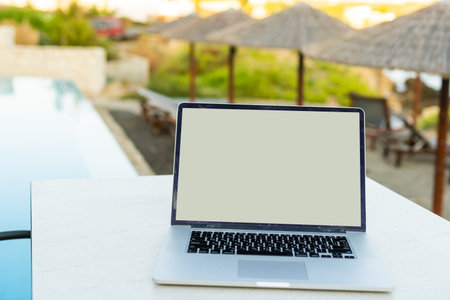 computer on table background as a pool.