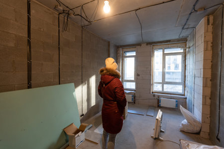 People renovating the house, woman in apartment renovationの写真素材