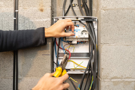 Electrician connecting cable . Mixed media