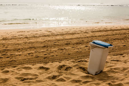 Trash barrel on beach, trash canの写真素材
