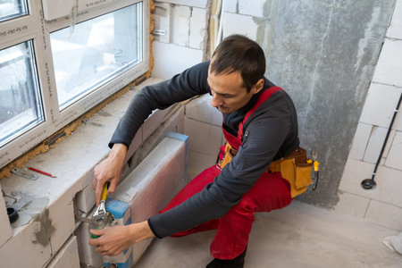 worker makes repairs to the heating battery