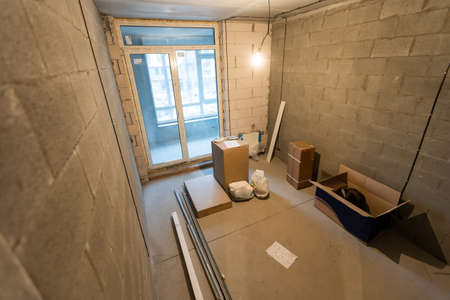 Working process of installing metal frames for plasterboard -drywall - for making gypsum walls in apartment is under construction, remodeling, renovation, extension, restoration and reconstructionの写真素材