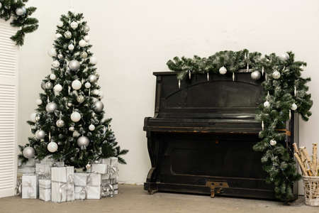 Grand piano in room decorated for Christmasの写真素材