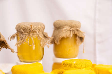 Jar of honey on wooden tableの写真素材
