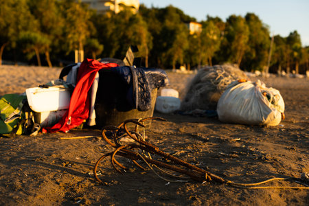 anchors and tackles on the sandy beach.の写真素材