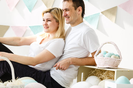 happy family with easter eggs. Happy family preparing for Easter.