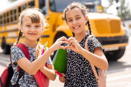 Two little kids going to school together