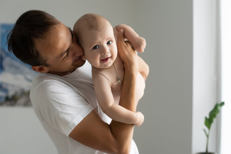 Father At Home With Newborn Babyの写真素材