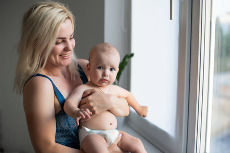 Portrait of happy mother and baby