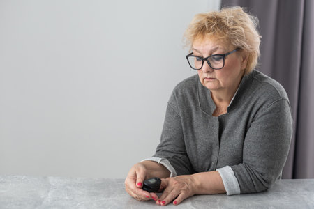 Assessment of the respiratory system function. measurement of blood saturation and pulse in an elderly patient using a pulse oximeter. health and medicineの写真素材