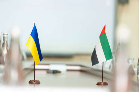 flag of ukraine and the united arab emirates on a white backgroundの写真素材