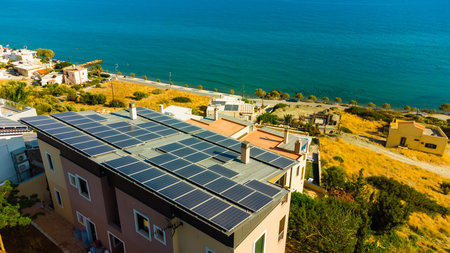 Solar photovoltaic panels on a house roofの写真素材