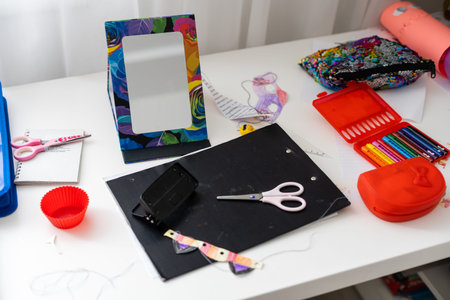 hand made scrapbooking post card and tools lying on a table