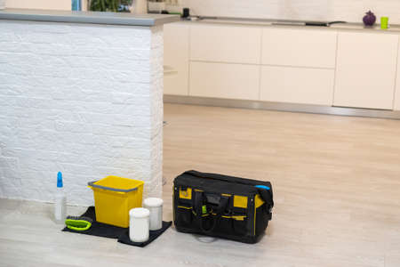 Collection of cleaning products and tools in living room, sofa cleaning products.の写真素材