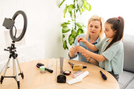 Female Vlogger Recording Broadcast At Homeの写真素材