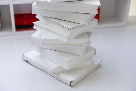 stack of books and the stand of books on white backgroundの写真素材