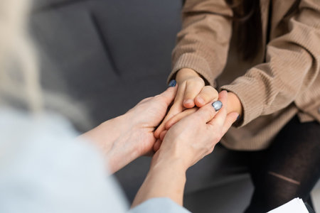 Meeting of pre-teen child girl and female social worker psychologist teacher at office