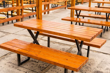 Camping gazebo with barbecue table and bench for outdoor picnic in summer outdoors.の写真素材