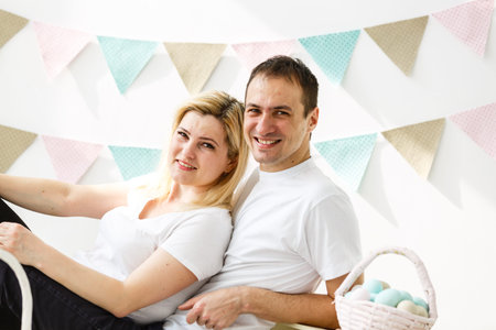 happy family with easter eggs. Happy family preparing for Easter.の写真素材