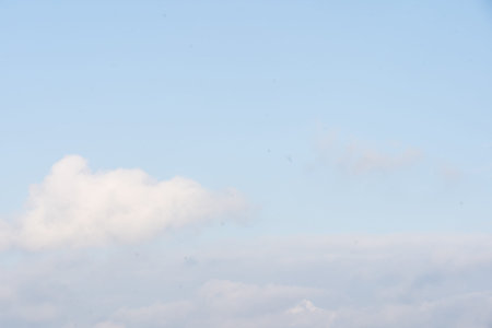 Sunny sky abstract background, beautiful cloudscape, on the heaven, view over white fluffy clouds,...