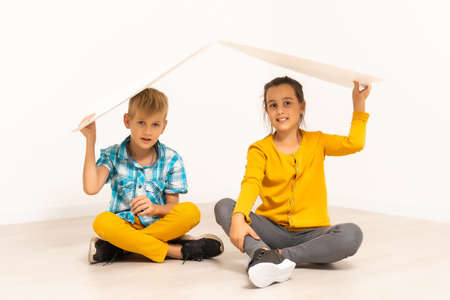 school children with roof on white background, isolated on white background.の写真素材